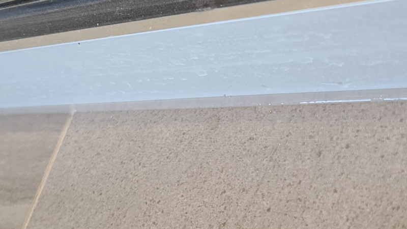 Expert interior caulking work on tile and bathroom ledges, ensuring a smooth, watertight seal that enhances both functionality and appearance.